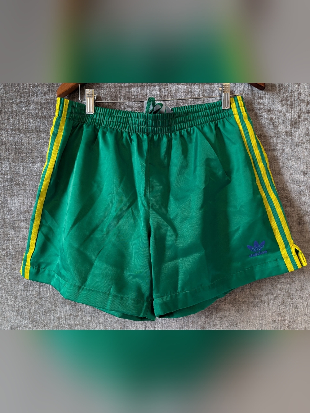 Adidas Green Athletic Shorts with Yellow Stripes